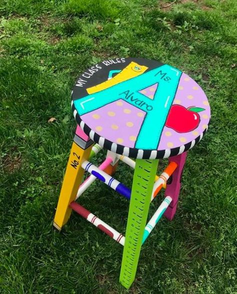 Jodi : Classroom Organization on Instagram: “A customized stool personalizes any classroom - How fun! This image was posted by Sydney from @hooray4teaching - Thanks for sharing this…” Diy Stools For Classroom, Teacher Stool, Painted Teacher Chair Classroom, Teacher Stools Painted Diy, Classroom Rocking Chair, Painted Teacher Stool, Teacher Rocking Chairs, Teacher Painted Rocking Chair, Teacher Stools