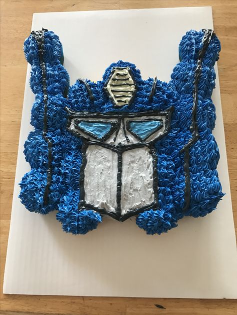 Optimus Prime pullapart cupcake cake! transformers Optimus Prime Cupcake Cake, Transformers Birthday Cupcakes, Transformers Cupcake Cake, Optimus Prime Cupcakes, Transformer Cupcakes, Transformers Cake Ideas, Rescue Bots Cake, Transformers Birthday, Transformers Cupcakes