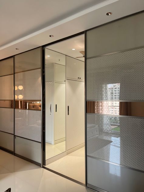 Sandwich glass layered with wallpaper, fabric and golden sheet Sandwich Glass Wardrobe, Glass Wardrobe, With Wallpaper, Wallpaper Fabric, Sliding Wardrobe, Bedroom Wall, Bedroom Interior, Guest Room, House Interior