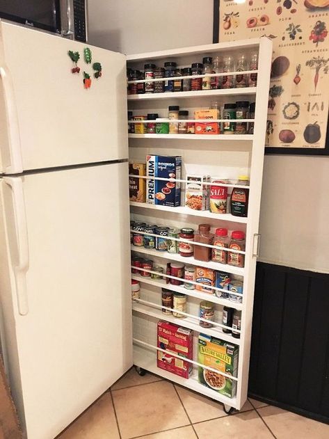 Get ready for a GAME changer! This is literally changing my life! Haha ok maybe not so dramatic, but this hide-away pantry is an amazing storage alternative that will open up some cabinet space!!! This kitchen storage is made by creating a slim sliding shelving unit for the space between your wall and refrigerator. It's amazing what a little wood and paint will do! Storage Cabinet Hack, Cabinet Storage Ideas, Small Home Improvements, Cabinet Hack, Diy Hidden Storage, Food Storage Cabinet, Storage Hacks Diy, Diy Rangement, Canned Food Storage