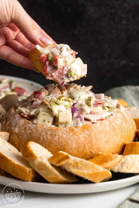 This Italian Hoagie Dip served in a bread bowl is like your favorite Italian sub- but in spreadable dip form! It's simple to make and so tasty. Dips In Bread Bowls, Bread Bowl Dip Recipes, Italian Dips, Italian Hoagie Dip, Hoagie Dip, Bread Bowl Dip, Italian Dip, Italian Hoagie, Italian Recipes Appetizers