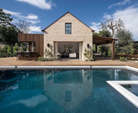 Tour a transitional Southern California home with charming French style French Transitional Home, French Transitional, Brick Archway, Custom Front Doors, French Oak Flooring, Glass Pool, French Style Homes, Blue Pool, Transitional House