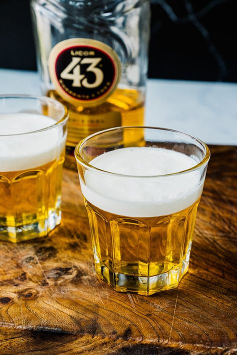 This Mini Beer Shot doesn't have beer at all! Here's how to make the popular little shot with Licor 43 liqueur and heavy cream. #minibeershot #littlebeershot #beershot #licor43 Shots With Baileys, Mini Beers, Mini Beer Shots, Alcohol Jello Shots, Beer Shots, Key Lime Martini, Beer Shot, Homemade Cocktails, After Dinner Drinks