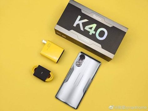 Silver Redmi K40 Game Enhanced Edition on a yellow table Redmi K40 Gaming, Latest Smartphones, Phone Design, Design Concept, Concept Design, Smartphone, Quick Saves, Design