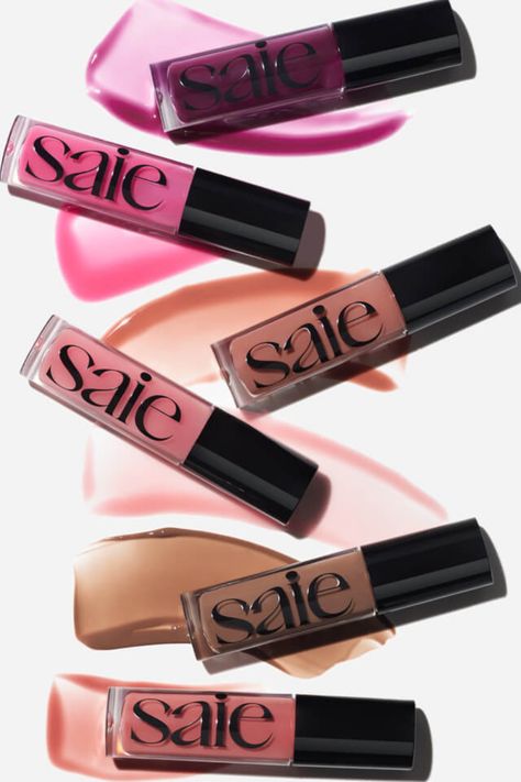 Get luscious lips with SAIE GLOSSYBOUNCE! 💋✨ This vegan lip gloss-oil hybrid combines the slip of a lip oil with the high shine of a sheer-tinted gloss. With a plush, non-sticky feel, it deeply hydrates and nourishes for juicy shine. Available in 6 shades for irresistible allure! #LipGloss #Hydration #SAIEBeauty Saie Beauty Lip Gloss, Saie Lip Oil, Saie Lip Gloss, Hydrating Lip Oil, Vegan Lip Gloss, Lip Gloss Shades, Lip Oils, Dream Diary, Tinted Gloss