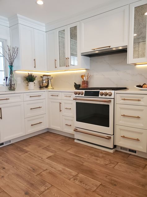 White And Bronze Kitchen, Ge Cafe Matte White, Modern Range Hood, Mirrored Cabinet Doors, Kitchen Hood Design, White Kitchen Appliances, Kitchen Renovation Inspiration, Kitchen Fan, White Oven