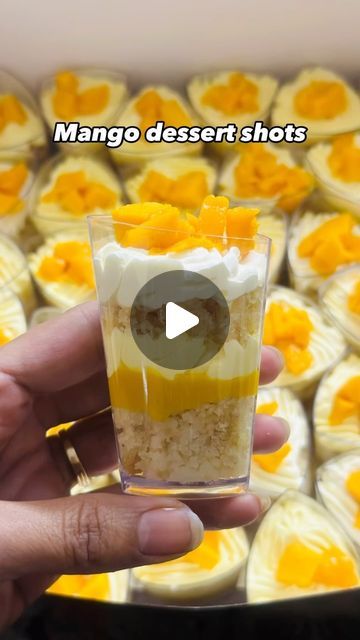 Preeti Kapil Bothra on Instagram: "Mango dessert shots to you: Mein aesi cheez hu... bilkul Lazeez hu 🤌 This heavenly dessert is the vibe of this summer! This Mango dessert shots is to die for! The smooth texture of cream cheese, taste of mango and crunch of biscuits...uff! Too good! . . #CAKALICIOUSCAKE #mangocake #mangodessertcake #mango #PartyDesertShots #SuratBaker #HomeBaker #SuratCake" Mango Shooters, Mango Cream Cheese Dessert, Dessert Shots Recipes, Mango Dessert Cups, Mango Cheesecake Shooters, Desert Mango Float, Mini Mango Cheesecake, Mango Graham, Cake Shooters