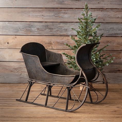 <p>Show off some of your favorite seasonal potted plants or use our <strong>Antiqued Decorative Metal Sleigh</strong> to hold decoratively wrapped gifts to create a charming holiday focal point. With a rustic black finish and a beautiful design, this large sleigh will easily become one of your favorite holiday pieces. Wherever you use this decorative sleigh, it will be a stylish and functional seasonal find.</p> Small Sleigh Decorating Ideas, Sleigh Decor, Christmas Sleigh Decorations, Winter Sleds, Cottage Chairs, Holiday Decorating Ideas, Distressed Table, Holly House, Wrapped Gifts