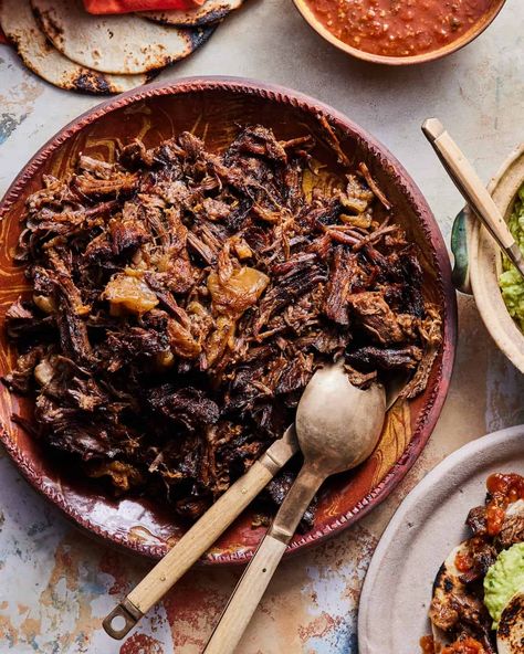 A bowl of cooked chuck roast taco meat Beef Chuck Tacos Crock Pot, Chuck Roast Tacos Olivia Adriance, Dinner Party Tacos, Viral Chuck Roast Tacos, Chuck Steak Tacos Recipes, Beef Chuck Tacos, Crockpot Chuck Roast Tacos, Chuck Roast Tacos Dutch Oven, Chuck Roast Fajitas