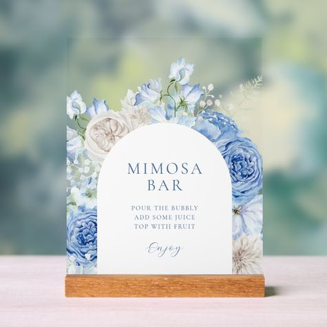 This bridal shower mimosa bar acrylic sign features a watercolor floral arch with elegant flowers in varying shades of blue and white, perfect for a "Something Blue Before I Do" theme. With its sophisticated flower frame and attention to detail, this mimosa bar sign will set the tone for a memorable and elegant bridal shower. Something Blue Bridal Shower Table Decor, Breakfast At Tiffanys Bridal Shower Theme, Blue Before I Do, Something Blue Before I Do Bridal Shower Theme, Bridal Shower Details, Bridal Shower Something Blue Theme, Something Blue Before I Do Shower Theme, Blue And White Bridal Shower Ideas, Something Blue Before I Do