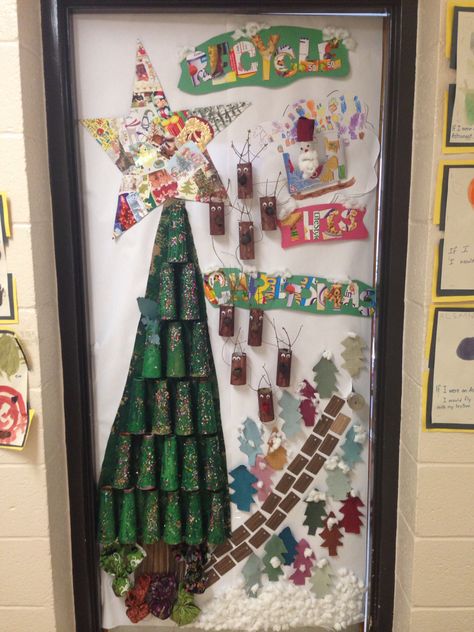 Classroom christmas door decoration made with recycled materials Recycled Christmas Door Decor, December Preschool, Diy Christmas Door Decorations, Recycled Christmas Decorations, Recycled Christmas Tree, Holiday Door Decorations, Recycled Door, Christmas Contests, Diy Christmas Door