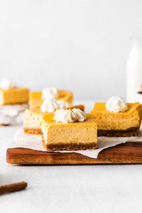 Simple and delicious Gluten Free Cheesecake Bars are easy to make and are a great pumpkin dessert for Thanksgiving! Cheesecake bars are quicker to make than a regular cheesecake. They’re portable and are a great option for make-ahead desserts to bring to a holiday dinner. Pumpkin cheesecake bars can also be made with regular graham crackers if you don’t need gluten free. Gluten free cheesecake recipe from @whatthforkblog - visit whattheforkfoodblog.com for more gluten free baking and desserts. Gluten Free Cheesecake Recipes, Gluten Free Pumpkin Cheesecake, Gluten Free Pumpkin Recipes, Thanksgiving Dinners, Gluten Free Graham Crackers, Cheesecake Layer, Pumpkin Cheesecake Bars, Pumpkin Cheesecake Recipes, Gluten Free Cheesecake