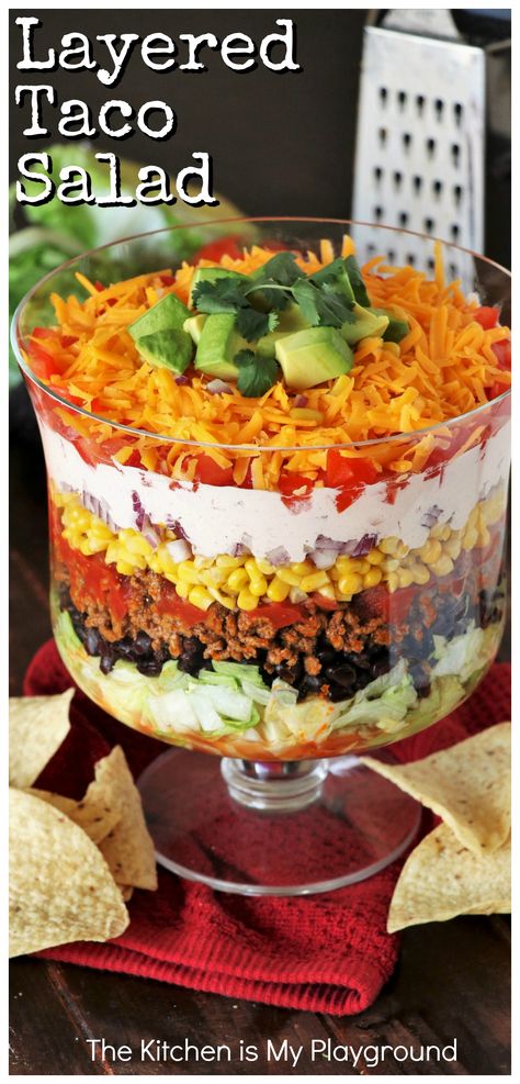 Layered Taco Salad {For a Crowd or Family Taco Night!} ~ Whip up this Layered Taco Salad instead of stuffing those taco shells! Perfect for lower-fuss taco night prep, or for making salad for a crowd. #tacosalad #layeredsalad #taconight #TacoTuesday www.thekitchenismyplayground.com Taco Salad For Party, Seven Layer Taco Salad Recipe, Mexican Layered Salad, Layered Salads For Parties, Mexican Salads For Parties, Taco Salad Layered, 7 Layer Taco Salad, Pasta Dishes For A Crowd, Taco Salad For A Crowd