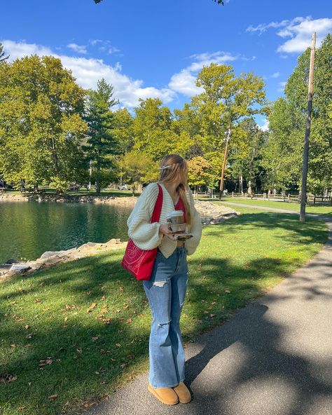 cardigan weather🫶🏻☕️🎃📕🍂 .. fall aesthetic, fall fashion, fall style inspo, fall outfits, fall inspiration, pinterest aesthetic, casual style, chunky cardigan, flare jeans, ugh minis, downtown girl style, starbucks fall menu Chilly Fits, Downtown Girl Style, White Cardigan Outfit, Tote Bag Outfit, Fall Menu, Autumn School Outfit, Red Tote Bag, Fall Inspiration, Red Tote