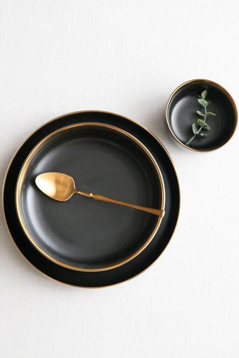 The Large Luxury Ceramic Black Bowl is the perfect addition to your dinner table! Our black dinnerware line calls for all of your attention! The black and gold color combination allows for all of the contrasting colors of your meals to pop! These bowls are great for soups, cereal, fruit bowls, and just about everything else. Add to your collection with other matching dishes for a full dining experience. Color: Black with gold trim Pattern: Solid Material: Ceramic Dimensions: 7.4 x 2.9 inch Dishw Gold Rim Plates, Black Dinnerware, Gold Color Combination, Black Dinner, Modern Dinnerware, Black Bowl, Fruit Bowls, Metal Bowl, Gold Ceramic