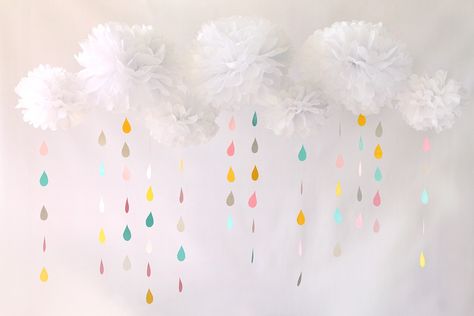 Create a multidimensional backdrop with white tissue pom poms as clouds, with colorful raindrop cutouts dangling beneath. Rainbow Theme Baby Shower, Rainbow Baby Shower Theme, Cloud Baby Shower Theme, Clouds Rainbow, Sprinkle Shower, Trendy Baby Shower Ideas, Sprinkle Baby Shower, Unicorn Baby Shower, Rainbow Baby Shower