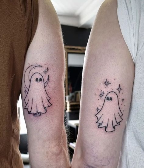 Ethereal Elegance: 11 Ghost Tattoo Ideas for a Hauntingly Beautiful Look Halloween Sibling Tattoos, Halloween Tattoo Ideas Matching, Best Friend Halloween Tattoo, Ghost Ankle Tattoo, Ghost And Bat Tattoo, 2 Ghosts Tattoo, Matching Ghost Tattoos For Couples, Ghost Friend Tattoos, Best Friend Ghost Tattoo