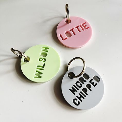 A lovely, personalised tag for your most special pet in a range of gloss or matte colours.  Each tag measures either 1 inch or 1.5 inches and is made from high quality 3mm acrylic. The letters are cut out with a laser machine so please bear this in mind and refer to the attached photo for examples of what the letters look like when they have been cut. The tag is very small and so is designed only to fit either a name or a phone number on, not both. Modern Key Holder, Tag Book, Tag Name, Id Tags, Make Happy, Laser Machine, Creative Packaging Design, Bag Tag, Personalized Tags