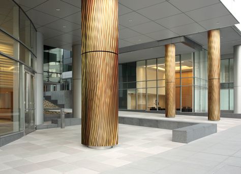 Shimmering waves of bronze  columns ... #MozDesignerMetals #ColumnCovers Exterior Column Design, Round Column Design Interior, Decorative Columns Interior, Column Design Exterior, Round Column Design, Round Pillar Design, Column Design Interior, Pillar Design Interior, Column Decoration Ideas