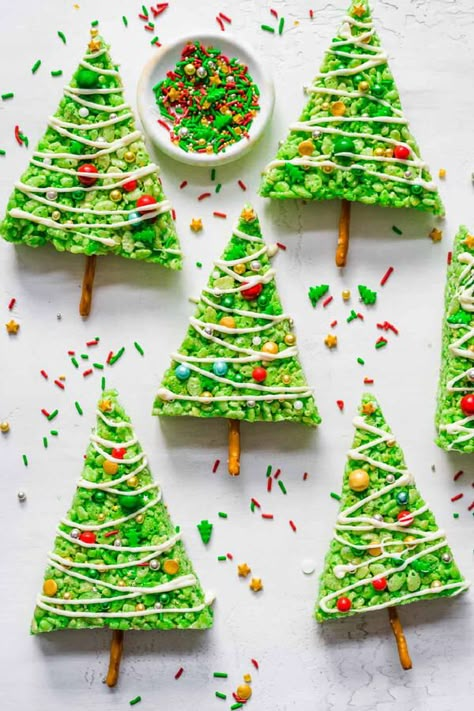 Rice Krispie Christmas Trees only take a few extra ingredients to turn regular marshmallow squares into gooey marshmallowy holiday crispy treats, and are so much fun! These little trees are full of holiday cheer. Easy To Make – Only a few simple ingredients are needed for this easy Christmas recipe, and they don’t take a lot of time to prep. Adorable For Christmas– Perfect for parties, potlucks, bake sales and cookie trays, school events, school lunches or any other event during the holiday seas Tree Rice Krispie Treats, Rice Krispie Christmas, Rice Krispie Christmas Trees, Kids Christmas Cookies, Kids Christmas Treats, Easy Kids Christmas, Krispie Treats Recipe, Christmas Recipes Easy, Christmas Sprinkles