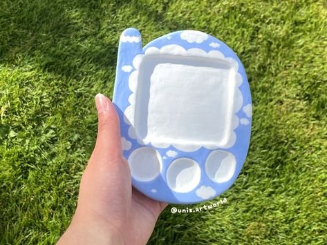 Do you like to paint or know anyone who does? Or you're looking for something to decorate your room with? Or are you looking for a unique gift for someone? If your answer is yes, then you're in for a treat! This handmade clay paint palette or trinket tray is perfect for you!  Ways to use it: -Watercolors -Gouache  -Acrylic gouache -Jewellery tray/ display etc. Item description: -The tray is around 11.5cm X 14cm X 1cm in size  -The tray weighs around 8.3oz (0.1kg) -Sculpted with air dry clay and Air Dry Clay Palette, Air Dry Clay Paint Palette, Clay Paint Palette, Clay Aiken, Clay Dish, Jewellery Tray, Room Decor Art, Jewelry Tray Display, Hand Painted Gifts