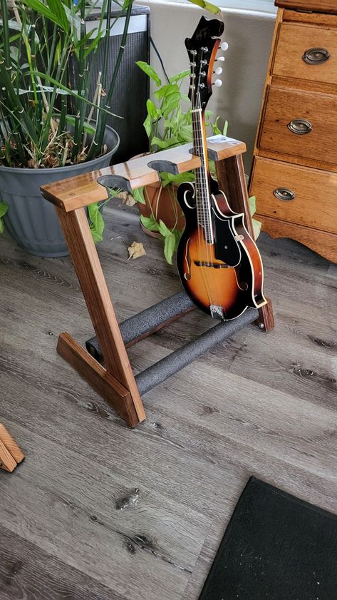 Top grade Walnut folding stand is perfect for ukes and mandolins. Other wood available i.e. Red Oak, Curly Maple, Cherry and more. Wooden Electric Guitar, Wood Guitar Stand, V Guitar, Ukulele Stand, Flying V Guitar, Wood Guitar, Guitar Stands, Activity Room, Flying V