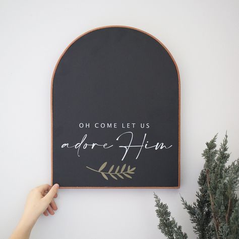 "**Sign comes with saying \"Oh come let us adore Him\" ** You choose the sign color (Black, white, smokey beige) as well as the leather frame color (Black, Cognac (tan * 15\"H x 12\"W x 1\"D * Handmade wood sign * Constructed from treated 3/4\" plywood * Sign is pictured in **Matte black paint/White lettering/Tan leather frame** **Every sign we create is handmade from start to finish, so there will be variations in texture, technique and overall appearance. We use 3/4\" maple plywood, so some pi Let Us Adore Him, Fall On Your Knees Christmas Sign, Modern Christmas Signs, Christmas Chalkboard Quotes, O Come Let Us Adore Him Sign, Oh Come Let Us Adore Him Sign, Oh Come Let Us Adore Him, Christmas Sayings Signs, Sayings For Signs Home Decor