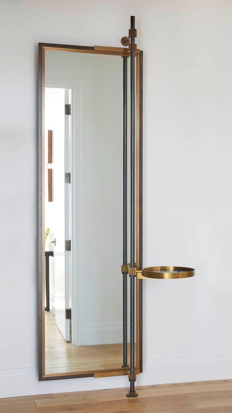 This full height mirror is housed in an oxidized oak frame with a warm brass decorative bezel. The round, swing arm tray, has an oxidized oak base with a solid brass surround and visible hardware. The Loft system's blackened steel support post runs Loft Mirror, Big Wall Art, Nate Berkus, Dressing Mirror, Brass Decor, Large Mirror, Bathroom Wall Decor, Mirror Designs, A Mirror