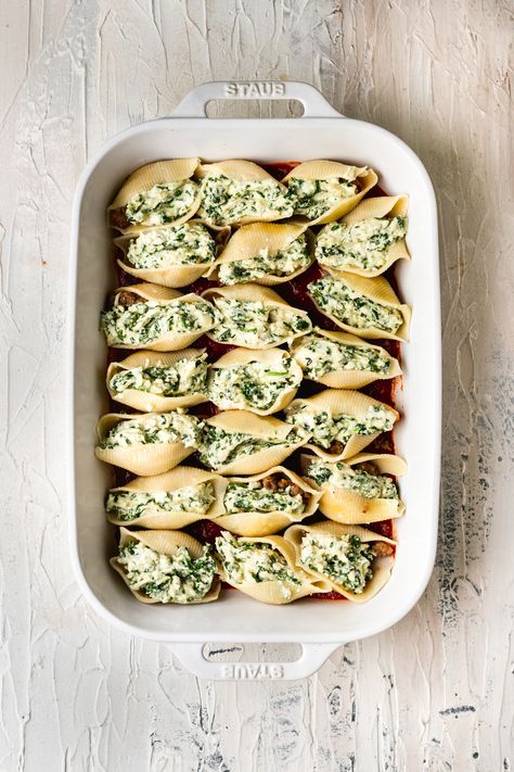 Spinach and Ricotta Stuffed Shells are filled with 3 types of cheese, marinara sauce and spinach. They are comforting, easy to make and a cozy weeknight dinner! Hello comfort food classic! #stuffedshells #spinachandricotta #jumboshells #shellpasta #pastarecipes #easydinners #comfortfood Easy Lasagna Recipe With Ricotta, Spinach And Ricotta Stuffed Shells, Ricotta Stuffed Shells, Lasagna Recipe With Ricotta, Spinach Stuffed Shells, Stuffed Shells Ricotta, Spinach And Ricotta, Jumbo Pasta Shells, Cheese Stuffed Shells