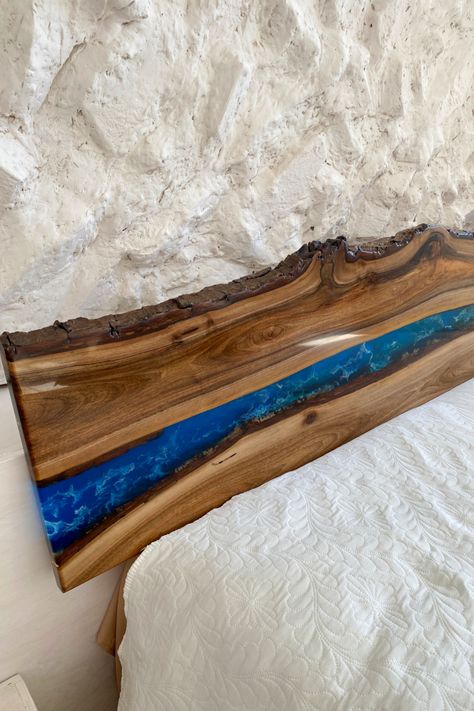 Elevate your bedroom decor with our exquisite Epoxy Resin Wood Headboard. This captivating piece features a mesmerizing epoxy river design flowing through a live edge wood panel, creating a unique and eye-catching focal point for your room. Crafted with meticulous attention to detail, this queen headboard combines the natural beauty of wood with the modern allure of epoxy resin. Experience the perfect blend of artistry and functionality in your sleep sanctuary. Cedar Headboard, Epoxy Decor, River Queen, River Design, Resin Decor, Sleep Sanctuary, River Art, Diy Epoxy, Epoxy Resin Wood