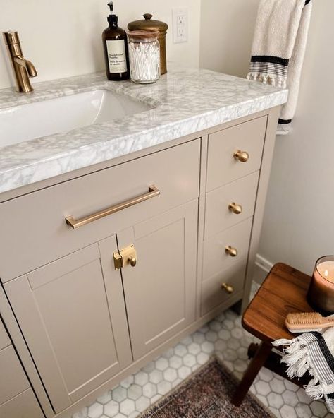 Jyll Mackie on Instagram: "Painting the vanity in our bathroom has been such a game changer! Obviously the new hardware helped too! (Swipe to see the before) If you’re newer here, the bathroom was the first room we renovated 5 years ago while I was pregnant with my first baby! The vanity that was supposed to be black arrived grey and I hated it from day one but we didn’t have time to return it and find something else! I lived with it for 4 years before finally painting it!! What do you think? Painted Vanity Bathroom, My First Baby, Instagram Painting, Home Reno, First Baby, Something Else, First Home, The Bathroom, Game Changer