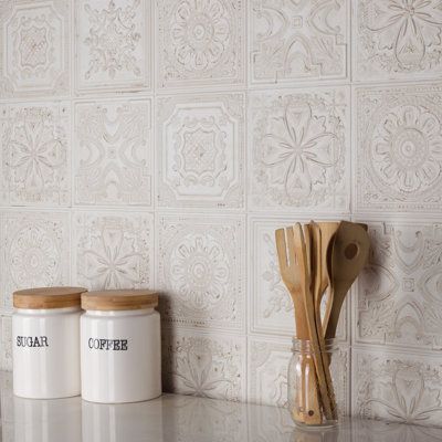 Reminiscent of antique tin ceiling tiles, our Fitz Ceramic Wall Tile offers authentic vintage appeal. This decorative square tile features embossed old-world motifs with splashes of glossy glazing. With a textured, mixed finish surface, this ceramic tile can blend into virtually any design theme, ranging from contemporary projects to traditional installations. Available in 40 print variations that are randomly scattered throughout each case, the variation throughout each tile mimics an authentic Backsplash Two Different Tiles, Printed Tile Backsplash Kitchen, White Texture Tile Backsplash, Kitchen Ceramic Tiles, Printed Backsplash Kitchen, Kitchen Tile Backsplash Pattern, Backsplash Kitchen Vintage, Old World Kitchen Backsplash Ideas, Patterned Tile Kitchen Backsplash