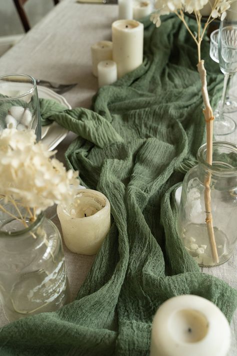 Product Description: The Rustic Greenery Table Runner for Boho Weddings and Home Decor is a perfect addition to your rustic-themed events and home styling. Handmade with love and care, this table runner adds a touch of natural beauty and elegance to any occasion. Made from high-quality cotton, pure cotton gauze, and cheesecloth, this runner features a rustic style that adds a charming and boho vibe to your space. With its natural cotton material and earthy colors, it effortlessly complements a w Woodland Wedding Centerpieces, Greenery Table Runner, Bachelorette Party Decor, Green Table Runner, Burnt Orange Weddings, Tafel Decor, Earthy Wedding, Modern Wedding Decor, Table Runners Wedding