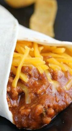 Taco Bell Chili Cheese Burrito Recipe ~ The chili cheese burrito combines chili flavored ground beef, refried beans and cheddar cheese in a tortilla. Taco Bell Chili Cheese Burrito Recipe, Chili Cheese Burrito Recipe, Chili Cheese Burrito Taco Bell, Cheese Burrito Recipe, Ground Beef Refried Beans, Chili Cheese Burrito, Cheese Burrito, Taco Bell Recipes, Burrito Recipe