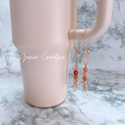 Custom Tumbler Charm Personalized Stanley Cup Charm Tumbler Jewelry Initial Charm Drink Accessory Water Bottle Charm Wine Glass Gift For Her 💛More Charms💛 https://www.etsy.com/shop/TheGenieCreative?ref=seller-platform-mcnav&section_id=46127855 💛Popular tumbler charm! this colorful name charms can be attached as accessories to tumblers with handles, such as Stanley tumblers. This personalized charm tumbler accessory is adjustable. It can also be used as a wine glass charm. Great for house party gift! 🧡 Main Material: Letter beads/copper alloy ✈️ Our business processing time: 10-14days 👉Note: Due to the different monitor and light effect, the actual color of the item might be slightly different from the color showed on the pictures.Please allow 1-2cm measuring deviation due to manual me Tumbler Charms, Tumbler Handle, Drink Ware, Drinking Accessories, Bottle Charms, Wine Glass Charms, Custom Tumbler, Letter Beads, Glass Gifts