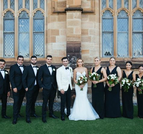 Real Wedding: A Modern Black and White Wedding with Lush Greenery Black And White Tuxedo Wedding, White Dinner Jacket Wedding, White Tux Wedding, Black And White Bridal Party, Black Bridesmaid Dress Mismatched, White Tie Wedding, White Tuxedo Wedding, Modern Black And White Wedding, Black And White Wedding Theme