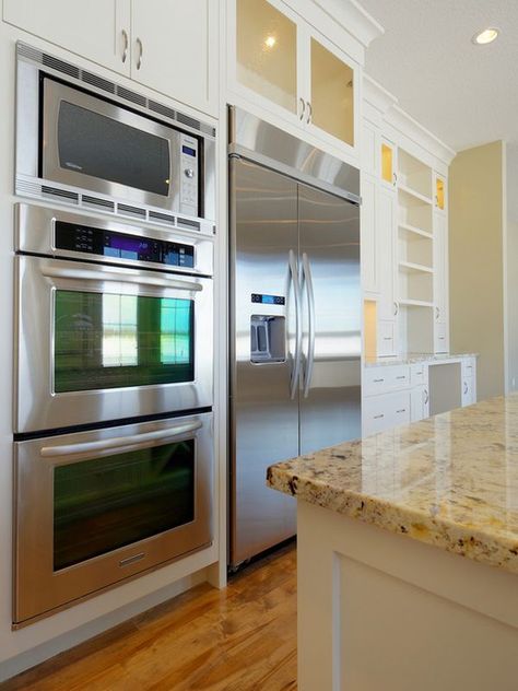 you could put the ovens next to the fridge with a microwave on top..... Stacked Ovens, Double Oven Kitchen, Kitchen Layouts With Island, Oven Design, Steel Appliances, Double Oven, Kitchen Redo, Family Homes, Stainless Steel Appliances