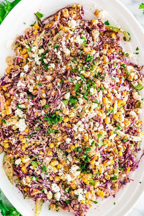 This Mexican Street Corn Slaw recipe is about to be your new favorite side dish! This smoky, creamy slaw complete with sweet charred corn and salty feta cheese will have you hooked from the first bite. #cornslaw #mexicancornslaw #mexicanstreetcorn Corn Slaw Recipe, Mexican Corn Slaw, Street Corn Slaw, Mexican Slaw Salad, Slaw For Street Tacos, Street Taco Slaw Recipe, Corn Slaw For Tacos, Mexican Street Corn Slaw, Mexican Corn Coleslaw