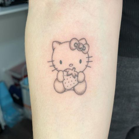 누리’s Instagram profile post: “CUUUUTE” Hello Kitty Strawberry Tattoo, Small Hello Kitty Tattoo, Hello Kitty Tattoo Ideas, Superhero Tattoos, Hello Kitty Tattoo, Kitty Tattoos, Strawberry Tattoo, Kitty Tattoo, Henna Inspired Tattoos