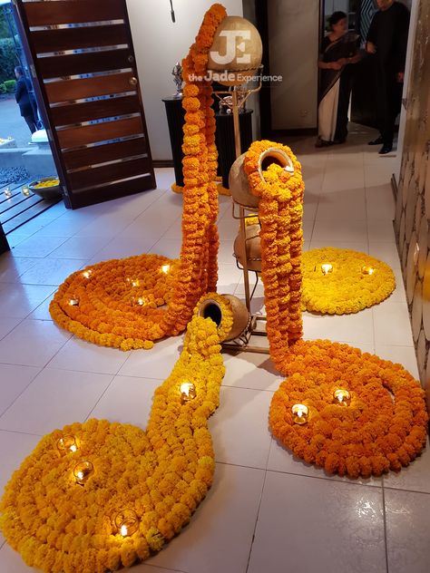 Entrance decor, Done with real marigolds and diyas. Elegant look for an evening function. Done by The Jadee Experience (Nairobi, Kenya.) #bigfatindianwedding #indiandecor #diyas #marigoldflowers #eventplanner Wedding Elegant Decoration, Flower Door, Decoration Event, Ganapati Decoration, Diwali Decorations At Home, Housewarming Decorations, Diy Diwali Decorations, Mandap Decor, Marriage Decoration