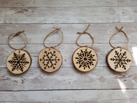 Wood burned snowflake ornaments in 4 different designs that you can enjoy on your Christmas tree and would look great with burlap ribbon for that rustic look. Comes in a set of 4 with twine ribbon and my signature on the back. 2 ornaments packed in each kraft gift box to protect the ornaments during shipping. Also makes a great gift! Wood Burned Ornaments, Ornaments Wood Slice, Wood Burned Gifts, Dragonfly Ornament, Wood Slice Ornaments, Ornaments Wood, Wood Burn Designs, Dragonfly Gifts, Illustration Noel