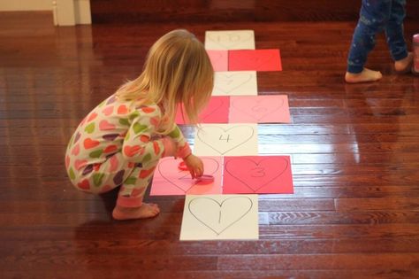 toddler approved heart hopscotch Heart Hopscotch, Games For Big Groups, Learning Games For Toddlers, Valentine's Day Party Games, Games To Play With Kids, Valentines Games, Positive Parenting Solutions, Valentine's Day Games, Valentine Activities