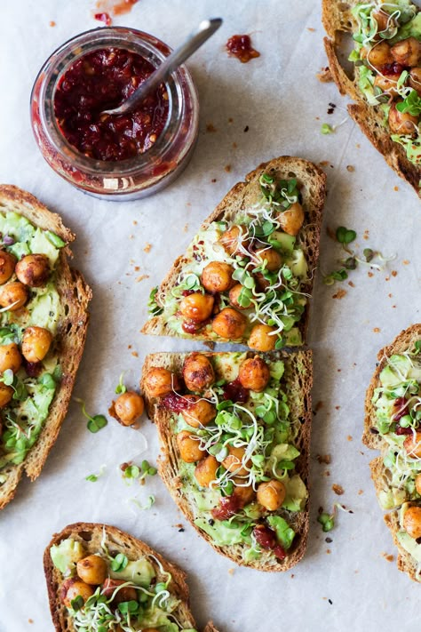 Vegan avocado toast with spiced chickpeas and sprouts is a super simple yet very nourishing meal that makes an awesome breakfast or lunch. It's gluten-free. Vegan Avocado Toast, Lazy Cat Kitchen, Brownie Cheesecake, Spiced Chickpeas, Avocado Toast Recipe, Toast Toppings, Toasted Bread, Toast Recipes, Vegan Breakfast Recipes