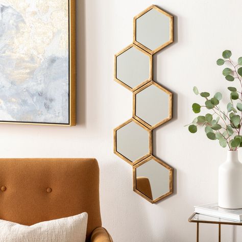 Create visual rhythm and movement in your home with the Falak Modern Geometric Hexagons Mirror. The repeating patterns of hexagonal shapes are key in this design, providing a modern edge and a talking piece in any room. Hexagon Wall Mirror Decor, Honey Comb Mirror Wall, Hexagon Mirror Design, Hexagon Mirror Wall Decor Pattern, Ikea Board, Hexagon Mirrors, Hexagon Mirror Wall Decor, Louver Design, Honeycomb Mirror