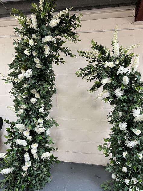 This listing is for a beautiful set of flower columns, free standing, absolutely perfect for any events or weddings.  This beautiful flowers are permanently set onto  an aluminium frame and the frame comes apart in multiple small pieces.  The tallest column is slightly angled and it's made out of 6 individual pieces that slot in between eachother. It measures 2.4m tall The shorter column also angles slightly at the top and it's made out of 4 individual pieces that slot in eachother. This measure Flower Columns, Floral Columns, Wedding Flower Arch, Wedding Columns, Standing Flower, Floral Arch Wedding, Aisle Runners, Flower Arch, Wedding Arch Flowers