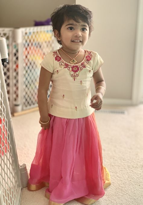 Baby in multicolour georgette pavadai & cream blouse with simple floral thread work Thread Work Blouse Design, Blouse Designs For Kids, Thread Work Blouse Designs, Thread Work Blouse, Pattu Pavadai Designs, Pattu Langa, Work Blouse Designs, Pattu Pavadai, Shrug For Dresses