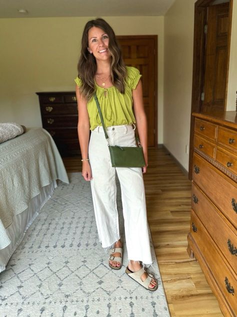 lime green babydoll top outfit, white wide-leg jeans fashion, casual summer outfit ideas, boho chic style, trendy babydoll top look, summer casual style, wide-leg jeans outfit inspiration, taupe suede Birkenstock sandals style, bohemian fashion, gold jewelry accessories, summer boho outfit ideas, lime green top and white jeans, casual everyday outfit, comfortable summer style, effortless chic fashion, lime green and white outfit ideas, summer outfit with Birkenstocks, casual chic summer look, trendy bohemian style, lime green fashion trends, babydoll top styling tips, casual boho chic look, taupe suede sandals outfit, trendy summer outfit ideas, casual chic outfit inspiration, bohemian summer fashion ideas, babydoll top with wide-leg jeans Green And White Outfit Ideas, Lime Green Top Outfit, Outfit With Birkenstocks, Babydoll Top Outfit, Lime Green Outfits, Green Shorts Outfit, Lime Green Pants, Outfit Wide Leg, Green Top Outfit