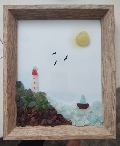 Beach Glass Lighthouse with a sailboat in the distance Sail Boat Sea Glass Art, Sea Glass Art Lighthouse, Beach Glass Lighthouse, Seaglass Lighthouse Art, Sea Glass Lighthouse, Newfoundland Crafts, Sea Glass Art Ideas, Beach Glass Projects, Seaglass Crafts