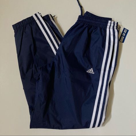 Adidas / Nwt Boys Nylon Jogger Track Pants Size Large (Boys) Color: Dark Blue W/White Stripes Along Side Leg Material: 100% Nylon Mesh Inside Lining Inside Draw Strings To Tighten Waist Elastic Waistband Side Pockets Side Zippers Bottom (Ankle) Pants With Elastic Ankle Brand New With Tags Blue Adidas Track Pants, Summer Swag Outfits, Tighten Waist, Black Athletic Pants, Adidas Bottoms, Adidas Sweats, White Joggers, Cute Pajama Sets, Girls Joggers