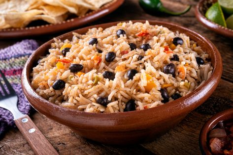 This black beans and rice recipe couldn’t be easier, and chances are you have all the ingredients on hand. It comes together in about 20 minutes. Black Beans And Rice Recipe, Seafood Salad Pasta, Cuban Black Beans, Cuban Dishes, Black Beans And Rice, Cuban Cuisine, Beans And Rice, Cooking White Rice, Pork Meat